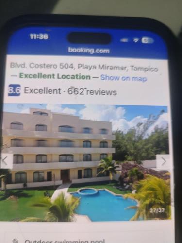 a sign for a hotel with a picture of a building at Arenas del mar in Monterrey
