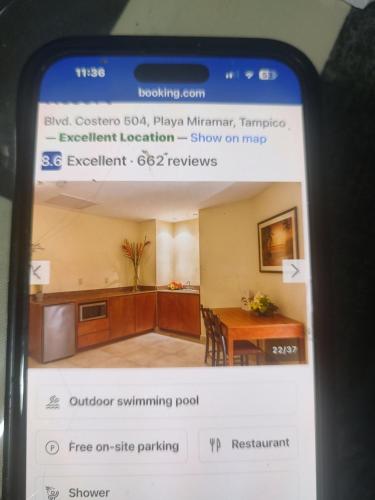 a cell phone screenshot of a room with a kitchen at Arenas del mar in Monterrey