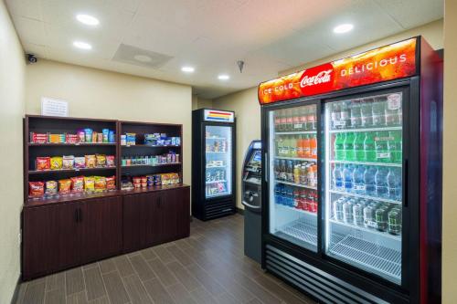 a store with two soda machines in a store at Comfort Inn Pensacola - University Area in Pensacola