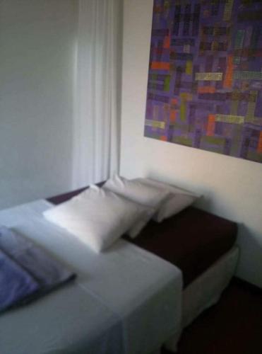 Ένα ή περισσότερα κρεβάτια σε δωμάτιο στο Mirante do Forte