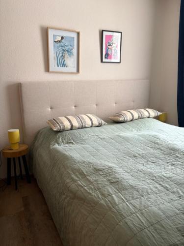 a bedroom with a bed with two pillows on it at Ferienwohnung Alva Hinterzarten in Hinterzarten