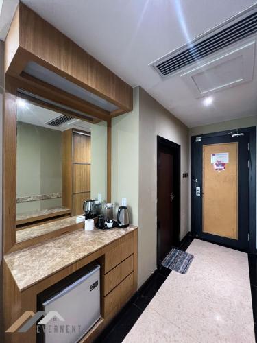 a bathroom with a sink and a counter top at Evernent Meritz in Miri