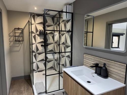 a bathroom with a sink and a shower at Uno Moor Side - 4 Bed, 2 Bath, Garden, sleeps 8 - Parking in Carbis Bay