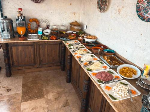 a buffet line with many different types of food at Erdu Cappadocia Stone House in Avanos