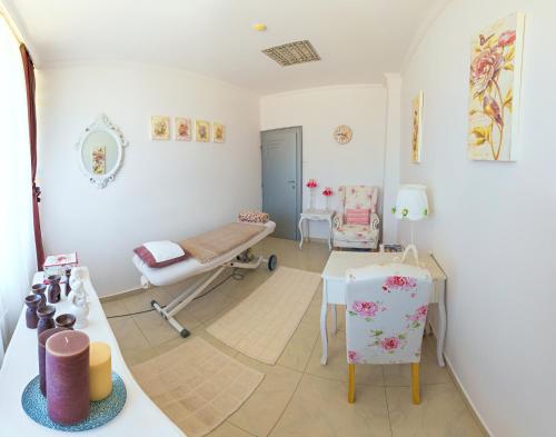 a hospital room with a bed and a table at Hotel San Terme Laktaši in Laktaši