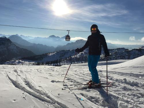 a person on skis standing on a ski lift at Gästehaus Nassfeld in Tröpolach
