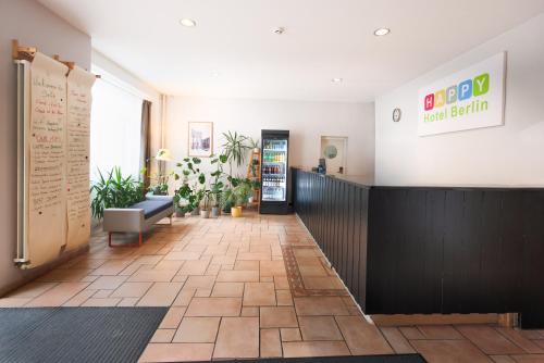 a lobby of a fast food restaurant with a waiting room at Happy Hotel Berlin in Berlin