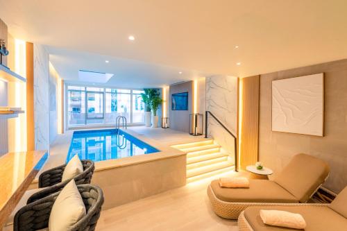 a living room with a swimming pool and a house at Al Bandar Arjaan by Rotana – Dubai Creek in Dubai