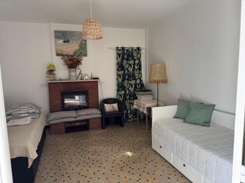 a bedroom with a bed and a desk and a chair at ancienne ferme maison familiale in Chaucre