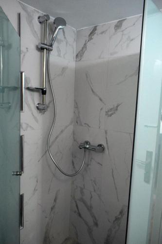 a shower with a shower head in a bathroom at Art House by Helen in Soroni Rhodes in Rhodes Town