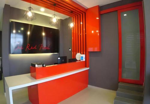 an office with a red trial sign on the wall at The Red Hotel in Bandar Saujana Putra