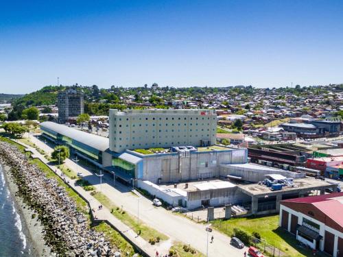 an aerial view of a city with a building at ibis Puerto Montt in Puerto Montt