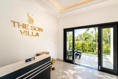 a room with a sign that reads the son villa at The Son Villa Hội An in Danang