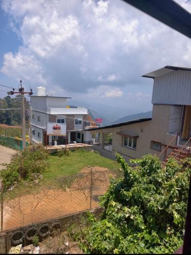 a view of a building with a yard in front at NILORA stay KODAI in Kodaikānāl