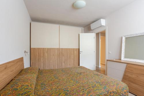a bedroom with a bed and a dresser in it at Signa, Firenze Casa Pilade in Signa
