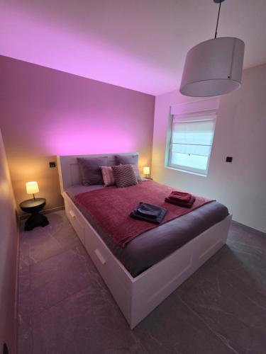 a bedroom with a bed with a purple ceiling at Flexi flat Gosselies Providence 11 in Charleroi