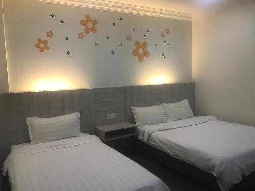 Postel nebo postele na pokoji v ubytování Tambun Inn Hotel