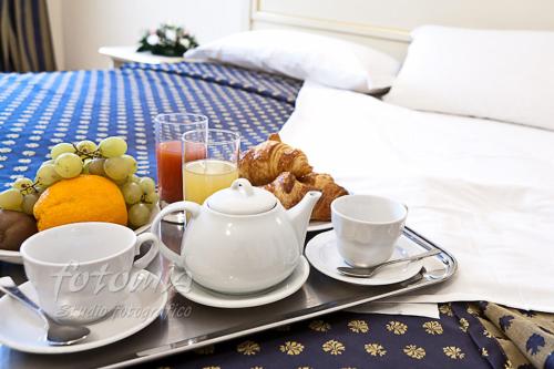 Una cama o camas en una habitación de Hotel Ai Dogi
