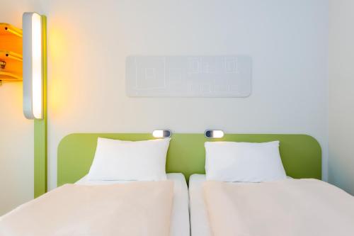 Un ou plusieurs lits dans un hébergement de l'établissement ibis budget Concarneau
