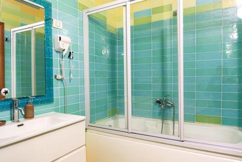 a bathroom with a shower and a sink at Central Blloku 2 bedroom Apartment in Tirana