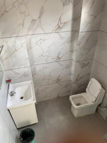 a bathroom with a sink and a toilet at Sundervan Resort in Alwar