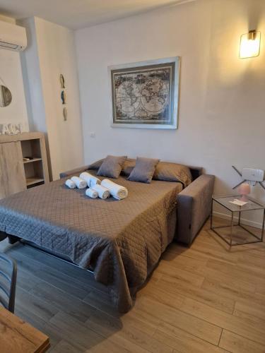 a bedroom with a bed with two stuffed animals on it at BINARIO 16- new loft in Marone