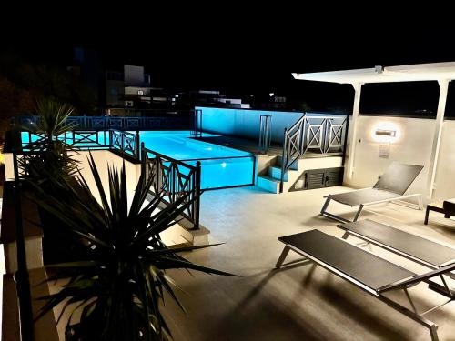 a balcony with a table and chairs on a ship at night at Luxury house Prestige Split in Split