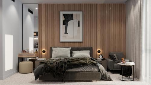 a bedroom with a bed and a chair at IDEA Collection by GINO Hotels in Tbilisi City