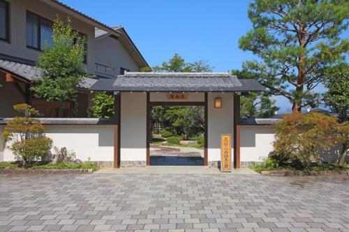 a house with a gate in front of it at Shiki Resort Hida Takayamaso in Takayama
