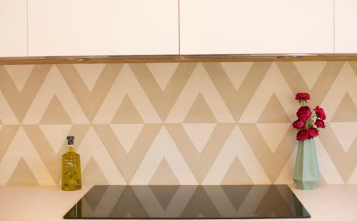 a kitchen counter with a sink and a bottle of wine at Mallorca Soller Port Villa High end Balearics in Port de Soller