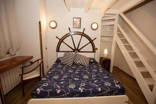 a bedroom with a bed and a staircase at Hotel Ausonia in Naples