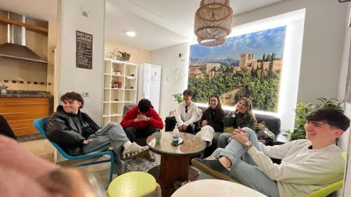 a group of people sitting in a room at Oh! My Hostel in Granada
