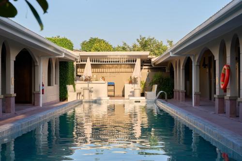 a swimming pool in front of a house at BARA BARA' Budget SATUN 'SHA Plus' in Satun