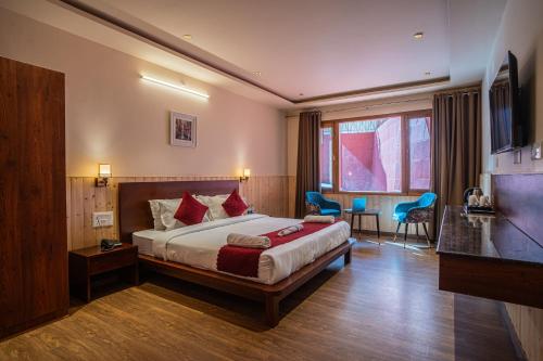 a bedroom with a large bed in a room at New Armadale Nainital in Nainital