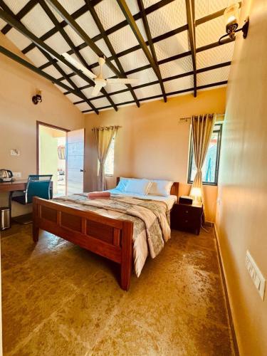 a bedroom with a large bed in a room at Airyaman Hollistic Hive in Narasimharaja Puram