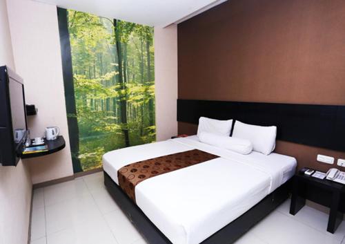 Tempat tidur dalam kamar di Vio Hotel Pasteur