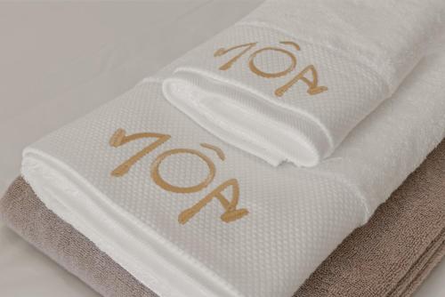 a white towel with the number on it at NÔA Curacao in Willemstad