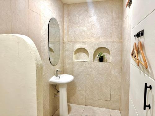 a bathroom with a sink and a mirror at Sunvada Beach Rayong in Rayong