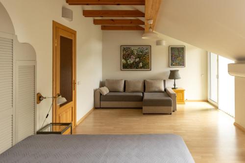 a living room with a couch at AV villa in Nida