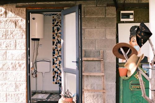 a door of a house with a mask on at Nomad Yurt, 60 year old in Ryskulovo