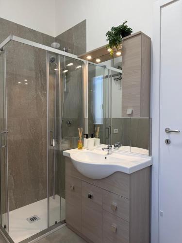 a bathroom with a sink and a shower at AlexBnB in Turin