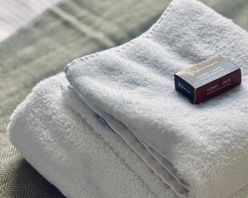 a book sitting on top of a white towel at Bracken Cottage in Killean