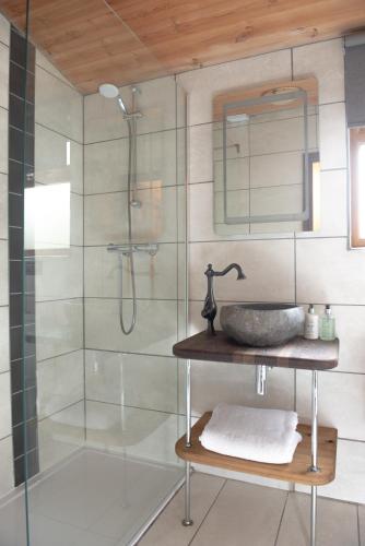 a bathroom with a sink and a shower at Britannia Petite Lodge - Still Rabbit - Hot Tub - Yorkshire in Selby