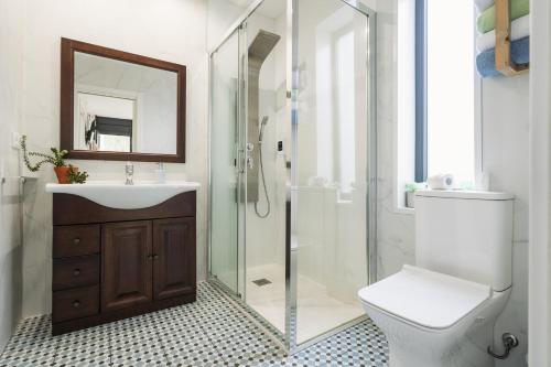 a bathroom with a shower and a toilet and a sink at Casa Salitre in Boiro