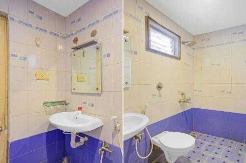 a bathroom with a sink and a toilet at MGR Residency in Pondicherry
