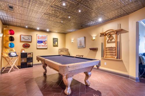 a pool table in a room with a ceiling at Pool Table, Massive Balcony, Firepit, & Spacious! in Sherrills Ford