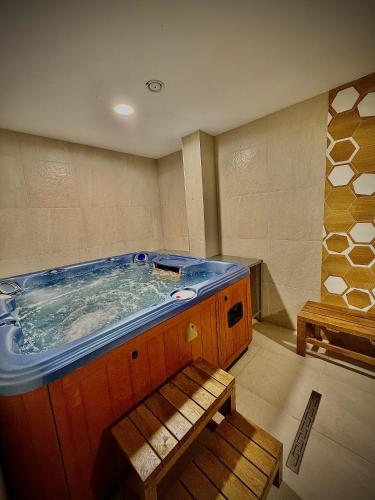 a large jacuzzi tub in a room at Tryavna Lake Hotel & SPA in Tryavna