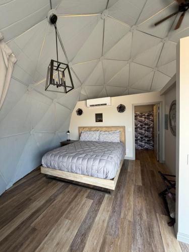 a bedroom with a bed in a tent at Bryce Glamp And Camp in Cannonville