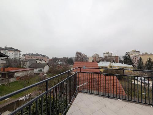 a balcony with a view of a city at Spacious Condo w Terrace & Piano in Sesvete