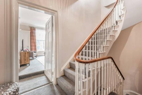 a staircase in a home with white walls at Great Gate House View - within York Walls in York